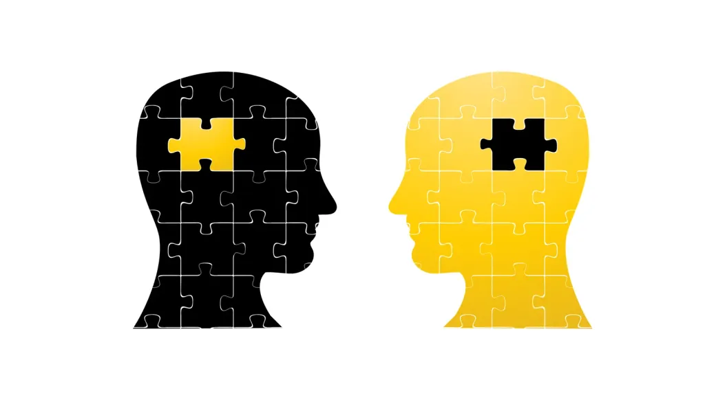 Deux silhouettes de têtes en pièces de puzzle, chacune portant la pièce qui manque à l'autre